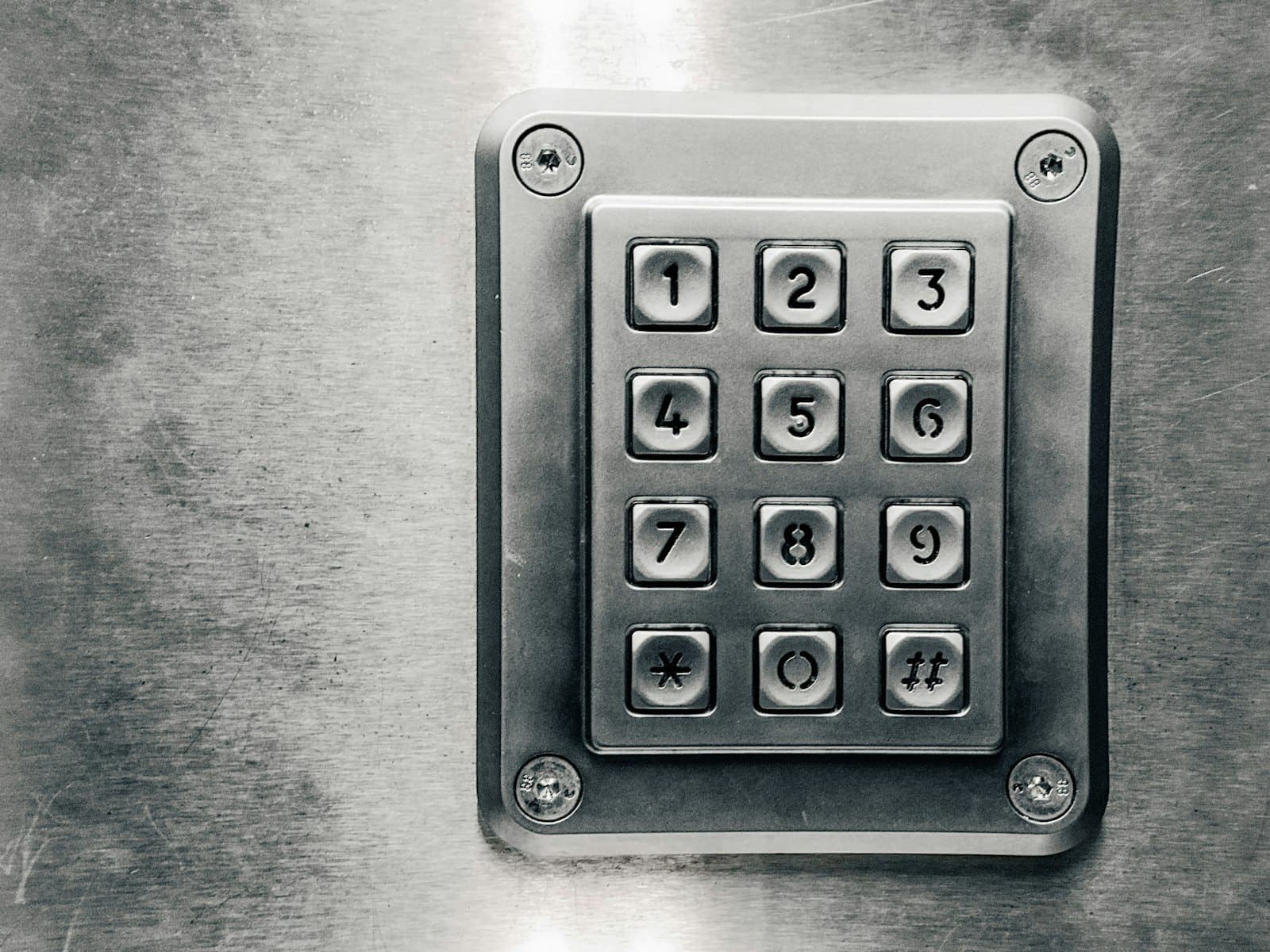 Stainless steel security keypad on a wall