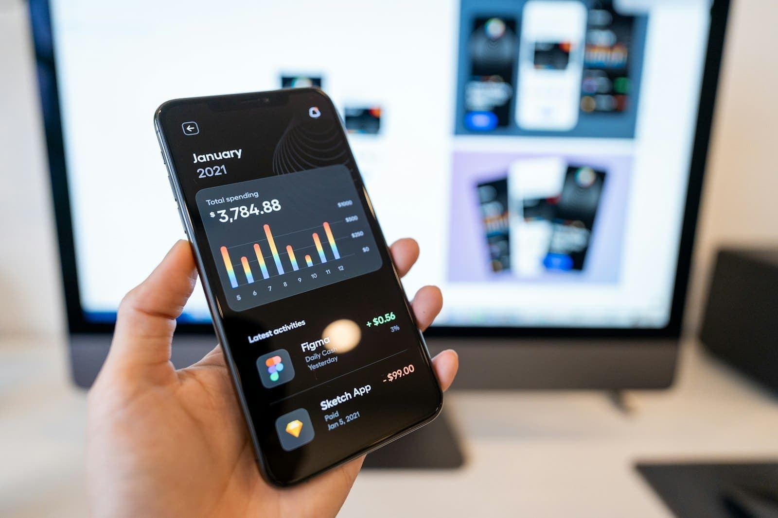 Hand holding a smartphone running a home control app